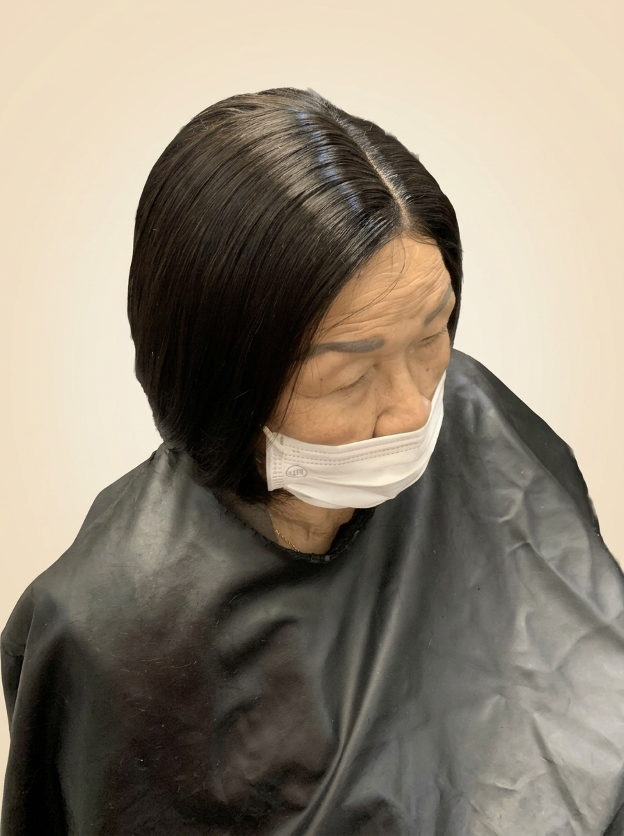 Smooth side-part bob with a sleek finish and soft curve under